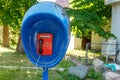 Urban payphone in the open air against the background of a Park