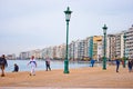 Urban pedestrians on pier at Leof Nikis street background at Thessaloniki Greece in March 2018. Greek urban people walking