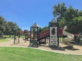 Urban playground at public park surrounded by large trees in downtown Dallas, Texas, USA Royalty Free Stock Photo