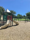 Urban playground at public park surrounded by large trees in downtown Dallas, Texas, USA Royalty Free Stock Photo