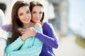 Urban portrait of two beautiful girlfriends. Royalty Free Stock Photo