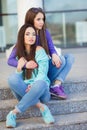 Urban portrait of two beautiful girlfriends. Royalty Free Stock Photo