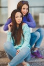 Urban portrait of two beautiful girlfriends. Royalty Free Stock Photo