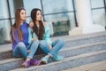 Urban portrait of two beautiful girlfriends. Royalty Free Stock Photo