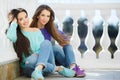 Urban portrait of two beautiful girlfriends. Royalty Free Stock Photo