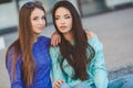 Urban portrait of two beautiful girlfriends. Royalty Free Stock Photo