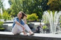 Urban portrait of young elegant business woman in eye glasses and casual clothes in city. Woman walking in green park, relaxing Royalty Free Stock Photo