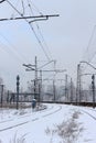 Urban railway system, railway tracks in snow, winter time.