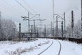 Urban railway system, railway tracks in snow, winter time. Royalty Free Stock Photo