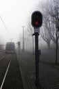 Urban railway track with red signal light