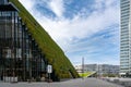 Dusseldorf - urban redevelopment. Diagonally rising walkable green roof, three-slice high-rise, modern architecture, green walls