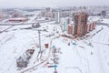 Urban residential district with new buildings under construction. aerial view in winter day Royalty Free Stock Photo