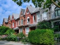 Urban residential street with colorful Victorian row houses