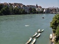 Urban river Rhine with moored rowing boats flowing through Basel Royalty Free Stock Photo