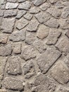 Sardinia. Traditional architecture. Urban road paved with rough ashlars of local volcanic stones. Detail