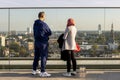 Urban rooftop viewpoint with cityscape through glass