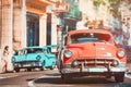 Urban scene with antique cars in Havana Royalty Free Stock Photo