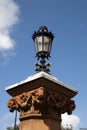 Old fashion street lantern/light on an ornate sandstone pillar Royalty Free Stock Photo