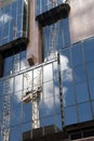 Reflection of crane from worksite in exterior of glass office building Royalty Free Stock Photo