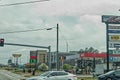 Urban scene with gas signs buildings and traffic