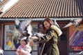 Sarajevo, Europe 09.02.2018, city square with mother and daughter feeding pigeons