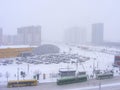Urban scene road street after snowfall, cold dawn over frozen city Minsk, Belarus