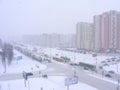 Urban scene after snowfall, snowy road in Minsk, Belarus