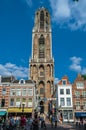 Urban scene in Utrecht, the Netherlands, colorful streets with the St. Martin's Gothic cathedral in the background