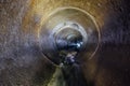 Urban sewage flowing throw round sewer tunnel pipe Royalty Free Stock Photo