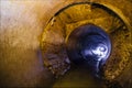 Urban sewage flowing throw round sewer tunnel pipe Royalty Free Stock Photo