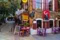Urban sidewalk with cafe terraces near Asansor in Izmir