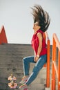 Urban skate girl with skateboard. Royalty Free Stock Photo