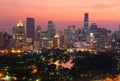 Urban skyline of Bangkok City at sunset, with famous landmark Mahanakhon Tower amid modern high rise buildings