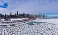 Urban Skyline of Chicago Loop and Frozen Lake Michigan with Ice Lumps on Winter Frosty Day. Aerial View. United States