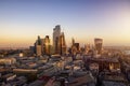 The urban skyline of the City of London during a golden sunset