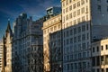 Urban skyline with modern buildings bathed in golden sunlight against a clear blue sky in Liverpool, UK Royalty Free Stock Photo