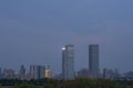 Urban skyscrapers under the rosy sky at nightfall;