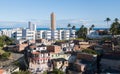 Urban social contrast. Slum and buildings. Drone aerial view