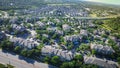 Urban sprawl mixed of apartment complex and single family houses subdivision in lush greenery area along busy E Whitestone Blvd