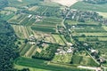 Urban sprawl in the north of Germany with small farmland, roads, houses, commercial enterprises and incoherent woodlands, aerial v Royalty Free Stock Photo
