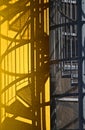 Stairs make some shadows on a yellow wall Royalty Free Stock Photo