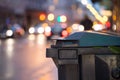 Garbage cans and street lights in urban city, evening Royalty Free Stock Photo
