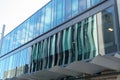 Urban street lined by modern glass facade buildings