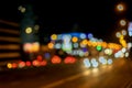 Urban street night traffic with bokeh lights. Blurred auto with bright brake lights, city street lights, speed. Abstract Royalty Free Stock Photo