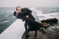 Urban style young happy couple standing on pier by the sea and passionately kissing. Wonderful honeymoon Royalty Free Stock Photo