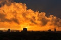 Urban sunset skyline with dramatic orange clouds. Royalty Free Stock Photo