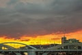 Urban sunset - View of William Jolly Bridge in Brisbane Australia at sunset with construction cranes and tall buildings in the Royalty Free Stock Photo