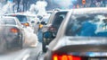 Urban traffic congestion with exhaust fumes pollution. Environmental and transportation concept