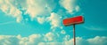 Urban Transit: A Captivating View of a Bus Stop Sign Against a Blue Cloudy Sky Royalty Free Stock Photo