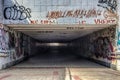 Urban underground tunnel with modern graffiti